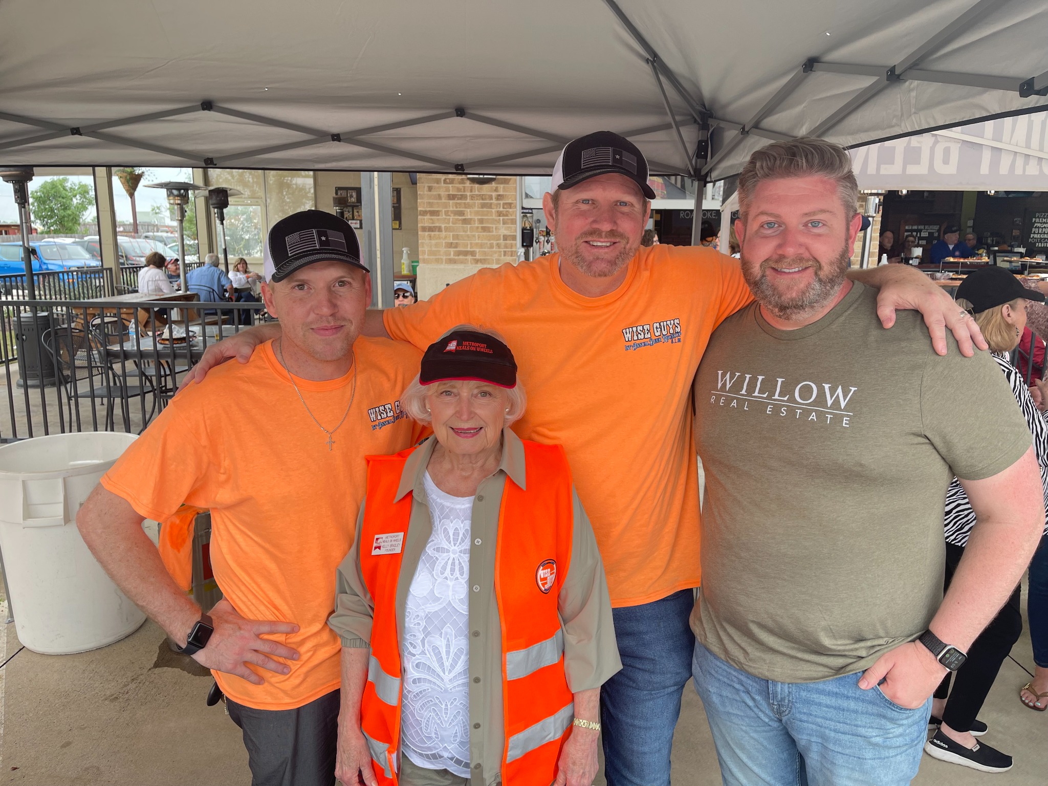 Todd Bingham with community members at an outdoor event